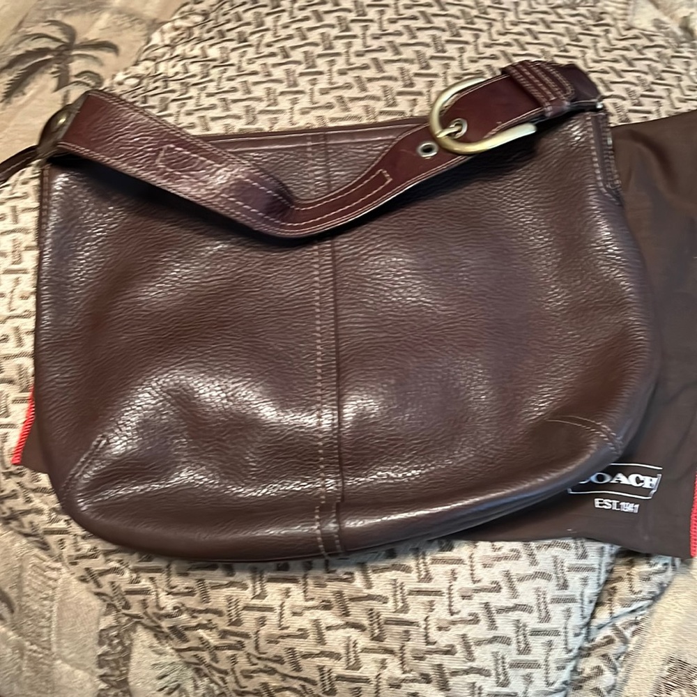 This is a beautiful barely used Coach Brown Pebbled leather Hobo Bag.